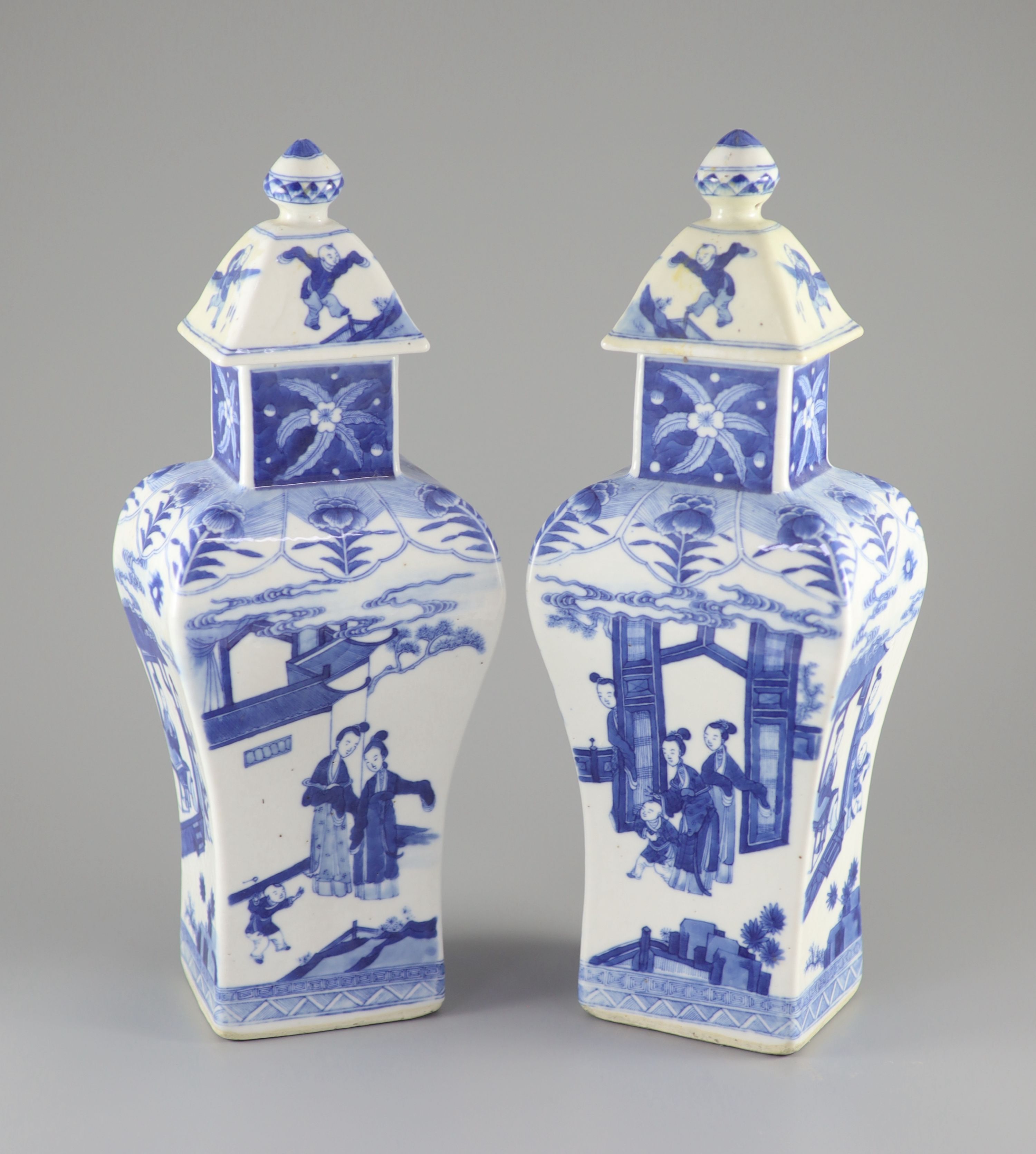 A pair of Chinese blue and white rectangular baluster vases and covers, Kangxi marks but 19th century, 36.5 cm